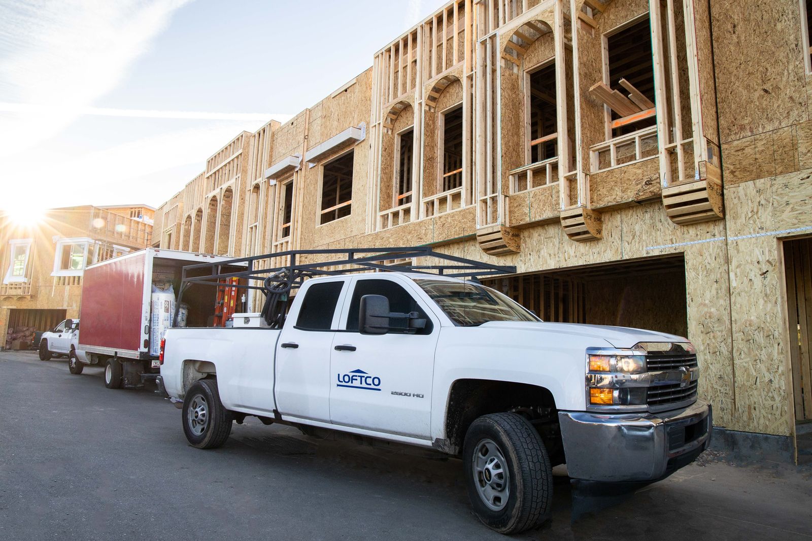 Loftco truck at a framing jobsite at golden hour